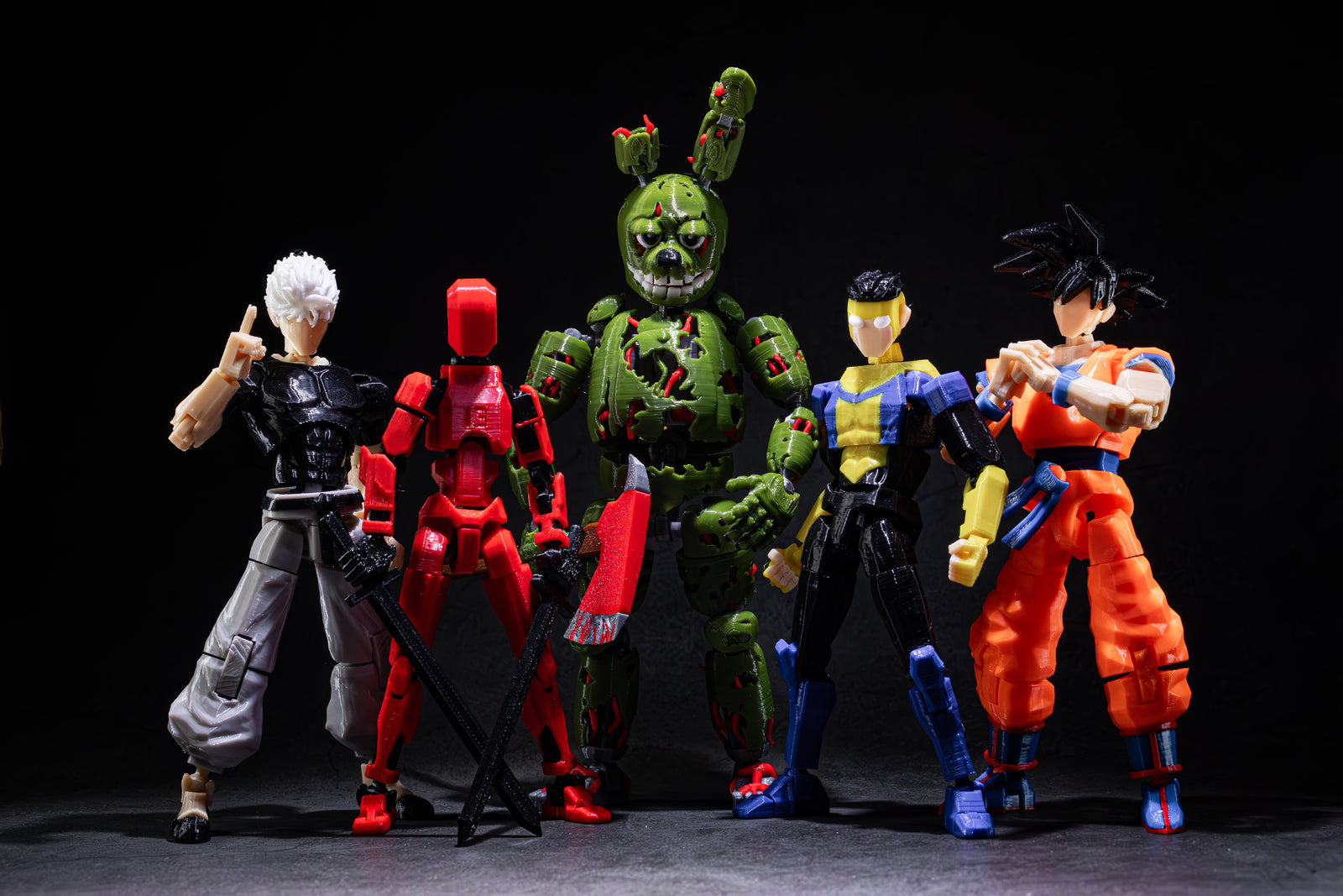 Five action figures in various poses on a dark background